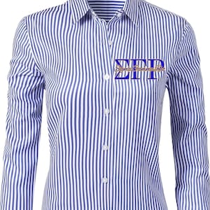 May include: A button-down shirt with vertical blue and white stripes. The shirt features the Greek letters "ΣΓΡ" in blue on the chest, with the words "Sigma Gamma Rho" below. The long-sleeved shirt has a classic collar and buttoned cuffs.