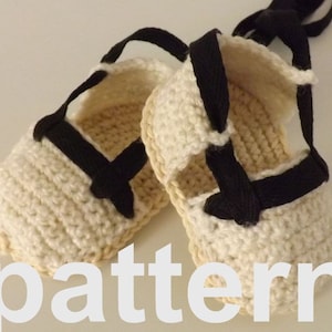 May include: A pair of crocheted baby sandals with black straps and a white background. The sandals are tied together with a black ribbon. The word "pattern" is written in white letters on a beige background.