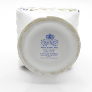 Close-up of base area showing small chip and clear Aynsley quality glaze and decoration.