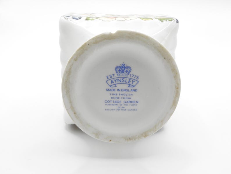 Close-up of base area showing small chip and clear Aynsley quality glaze and decoration.