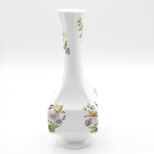 Bud vase styled as decor piece ideal for single stem flowers and English country inspired interiors.