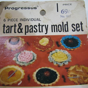 May include: A package for a 6 piece individual tart and pastry mold set. The package shows a variety of different tart and pastry molds with different fillings. The price is 69 cents and the number is 917.