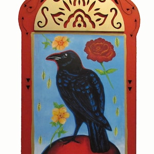 May include: A black raven perched on a red orb, surrounded by yellow and red flowers. The raven is depicted in a folk art style with a blue background. The image is framed in a red and gold wooden frame with intricate carvings.