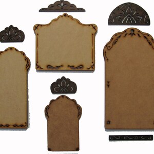 May include: Set of six unfinished wood craft tags with intricate cut-out designs. The tags are in various shapes and sizes, including rectangular, arched, and half-circle. The tags are perfect for adding personal touches to gifts, crafts, and home decor.