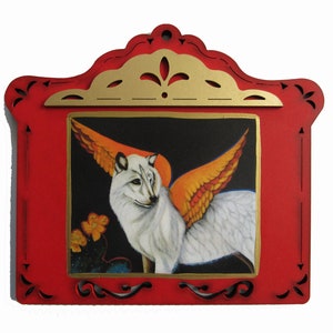 May include: A white wolf with orange wings is painted on a red wooden plaque with a gold frame. The plaque has a decorative design around the edges.