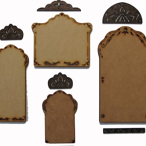 May include: Set of six unfinished wood craft tags with intricate cut-out designs. The tags are in various shapes and sizes, including rectangular, arched, and half-circle. The tags are perfect for adding a personalized touch to gifts, crafts, and home decor.