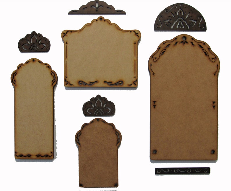 May include: Set of six unfinished wood craft tags with intricate cut-out designs. The tags are in various shapes and sizes, including rectangular, arched, and half-circle. The tags are perfect for adding a personalized touch to gifts, crafts, and home decor.