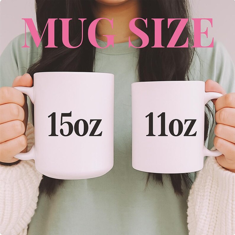 May include: Two white ceramic mugs, one labeled "15oz" and the other "11oz", are shown. The text "MUG SIZE" is above the mugs in pink. The mugs have a standard handle design. The mugs are held up.