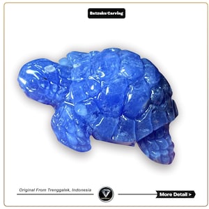 May include: A blue turtle carved from a translucent stone. The carving is detailed and intricate, with a textured shell and defined features. The turtle is a popular symbol of good luck and longevity.