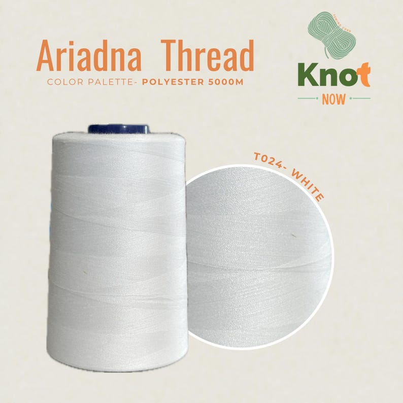 May include: A large spool of white Ariadna polyester thread labeled 5000M. The image includes the text Ariadna Thread, Color Palette- Polyester 5000M, Knot Now, and T024- White. The thread is wound onto a cylindrical spool with a dark top.