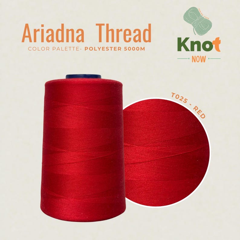 May include: A large spool of vibrant red Ariadna polyester thread with 5000M printed on the label. The text reads Ariadna Thread, Knot Now, and T025 - Red. The thread is wound tightly around a cylindrical core with a dark blue top cap.