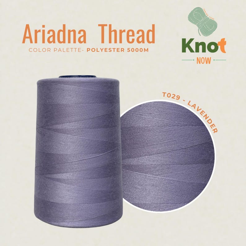 May include: A large spool of lavender polyester thread labeled Ariadna Thread, Knot Now, and T029 - Lavender. The thread is 5000m in length. The spool is cylindrical with a smooth, matte finish, showcasing a consistent light purple color throughout.