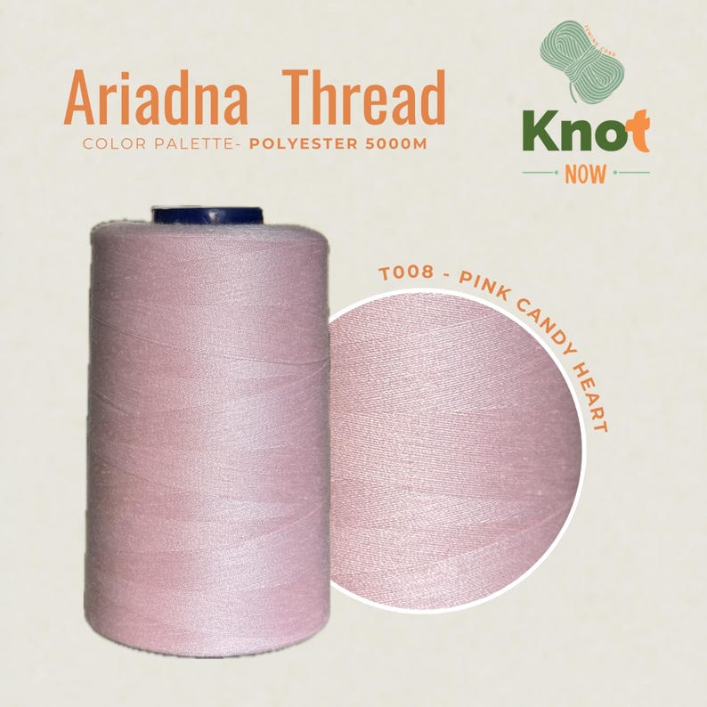 May include: A large spool of light pink polyester thread labeled Ariadna Thread, Knot Now, and T008 Pink Candy Heart. The thread is wound onto a cylindrical spool with a dark blue top cap, featuring a total length of 5000 meters of material.
