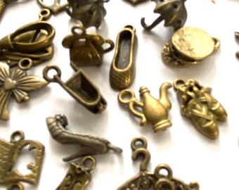 Lot of 90+ charms, assorted, antique brass. BC32