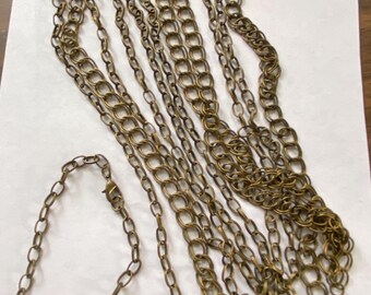 Lot of 12 charm bracelets -New, chain link, antique brass.  AB12