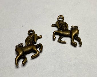 Lot of 11 Unicorn charms, antique brass, 1/2" long, double sided