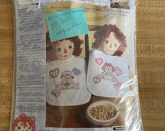 Raggedy Ann & Andy, Cross Stitch, 2 Baby Bibs, previously owned, with instructions, no floss or needle, 45665