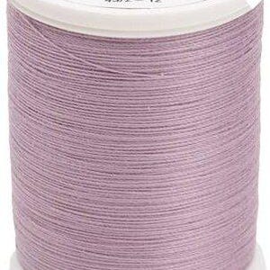 May include: A spool of light purple mercerized cotton thread with a white plastic top and bottom. The label reads Sulky, 100% Cotton, Use 90/100 Top Stitch Needle, 733, 1032, and Made in Italy. The thread is wound evenly around the central cylinder.
