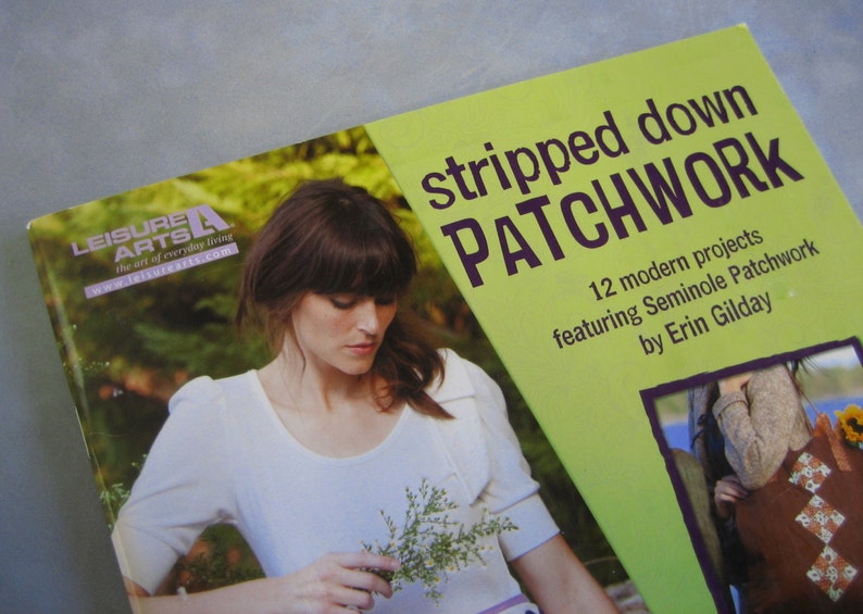 May include: A book cover with a green background and the title "stripped down PATCHWORK" in purple text. The book features 12 modern projects featuring Seminole Patchwork by Erin Gilday.