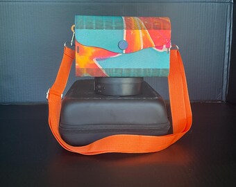 Handbag with a magnetic lock, mechanism and beautiful details and a great sturdy adjustable strap