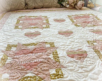 Handmade baby young child quilt. Heart quilt in beautiful pinks and gold fabrics