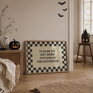 Funny Halloween bathroom wall art with a please do not brew potions in the bathroom message, designed for cute witch and witchy Halloween decorating. A playful choice for kids Halloween party decor, a children’s Halloween bathroom, potion themed party decorations, or a magical witch party. Pair with spooky bathroom decor, witchy decor prints, and family friendly Halloween decorations.