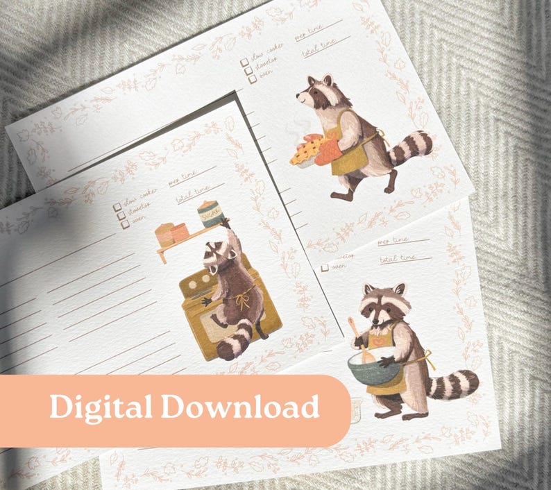 May include: Printable recipe cards featuring illustrations of raccoons baking. The cards have a floral border and spaces for writing down recipe ingredients, prep time, cook time, and total time.