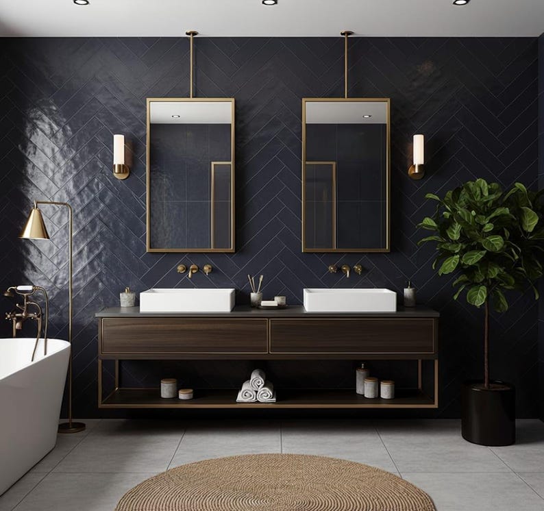 May include: A bathroom vanity with a dark wood finish, two white rectangular sinks, and gold faucets. Above are two rectangular mirrors with gold frames, wall-mounted lights, and dark blue herringbone tiles. A potted plant sits to the right.