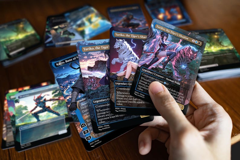 Printed Yuriko Ninjas proxy cards in hand, showing real card size, finish and anime artwork