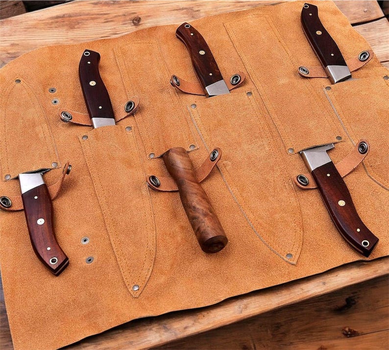 Protective leather knife roll, prevents damage"
"Convenient leather knife storage, easy access"
"Travel-friendly leather knife case, compact design"
"Durable leather knife roll, withstands heavy use"
Stylish leather knife storage, kitchen decor