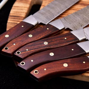 Authentic rosewood handle, natural beauty" "High-quality rosewood handle, durable construction"
 "Sustainably sourced rosewood handle, eco-friendly"
 "Rosewood handle with rich grain pattern"
"Exotic rosewood handle, luxurious feel
Chef's favorite