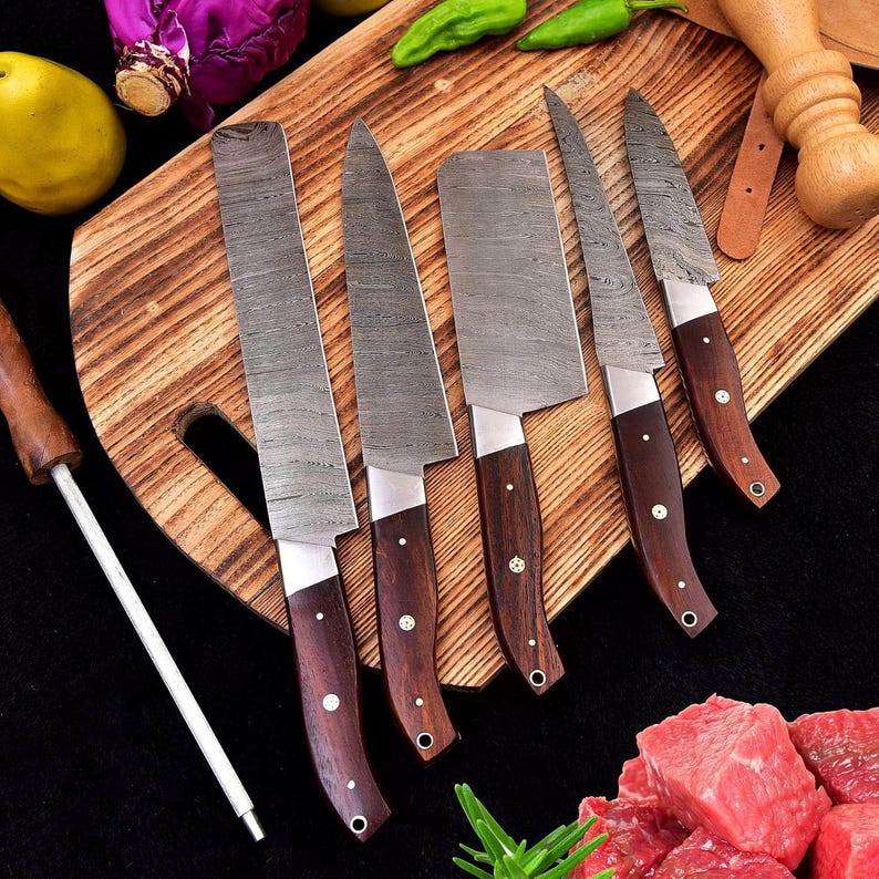 5-piece handmade Damascus steel knife set"
 "Customizable Damascus steel chef's knife set"
 "Premium 5-piece kitchen knife set"
"Damascus steel cooking utensils set"
"Hand-forged 5-piece cutlery set
Custom Knife Set
BBQ Accessories
Ergonomic Handles