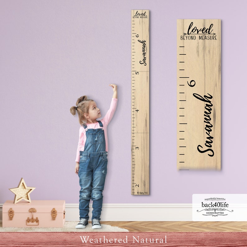 May include: A wooden growth chart with a weathered natural finish. The chart features a ruler with markings up to 6 feet, and the text "loved beyond measure" and "Savannah" in black lettering.