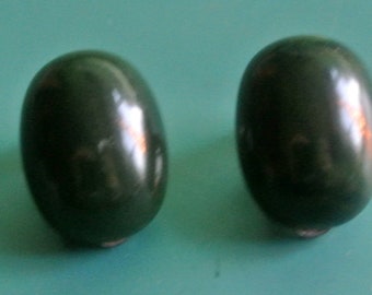 Collectible vintage 1940s unused oval opaque dark forest green tested bakelite earclips with silvercolor metal details