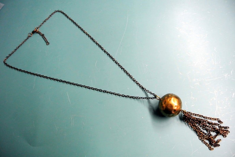 Rare vintage 1950s adjustable round handworked goldcolor brass bead pendant necklace with copper chain and tuft