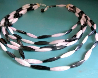 Adjustable vintage 1950s 6-stranded light pink/ black plastic necklace choker with long triangular beads and hook/ chain closure