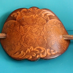 Strong Swedish vintage 1960s oval HANDMADE thick brown natural organic leather barette with stamped rose flower motive and wood pin