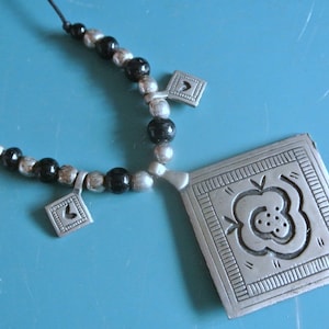 Adjustable vintage 1970s Sweden handcrafted rectangular pewter pendant necklace with metal wire and lobster clasp