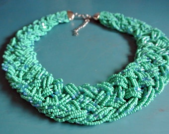 Adjustable vintage 1990s unused plaited multistranded handmade choker necklace with enamel green glass seed-beads and silvercolor details