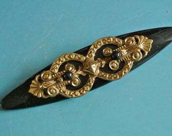 Unusual vintage 1970s unused black ellips-formed plastic brooch with brass ornament decor and working brass pin/ needle