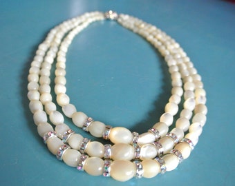 Outstanding vintage 1950s 3-stranded necklace choker of graduated oval glowing bonewhite mother of pearl mop beads with rhinestone rondellen