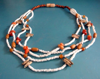Vintage 1970s unused handcrafted 3-stranded choker necklace made of shell/ coral/ teak wood beads, designed by Lee Sands