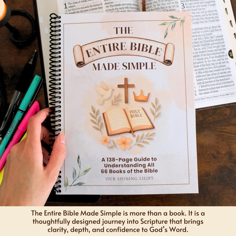 May include: A spiral-bound book titled "The Entire Bible Made Simple" with a cream-colored cover. The cover features illustrations of a cross, dove, crown, and open book. The book is a 138-page guide to understanding the Bible.