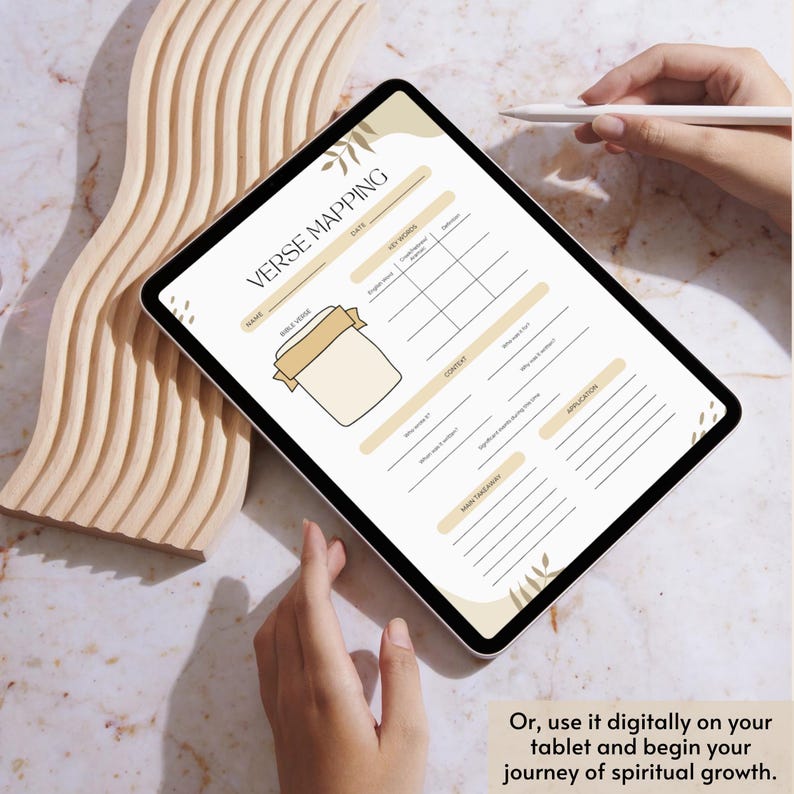 May include: A digital tablet showing a "Verse Mapping" template, featuring areas for Bible verse, keywords, context, and application. The tablet is held by a person, with a stylus. Text on the tablet reads "Verse Mapping".