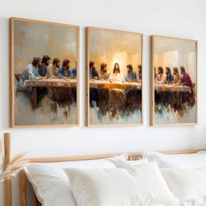 May include: A set of three framed paintings depicting a scene of Jesus and his disciples at the Last Supper. The paintings are in a muted colour palette with a focus on the figures and the table. The paintings are framed in a simple wooden frame.