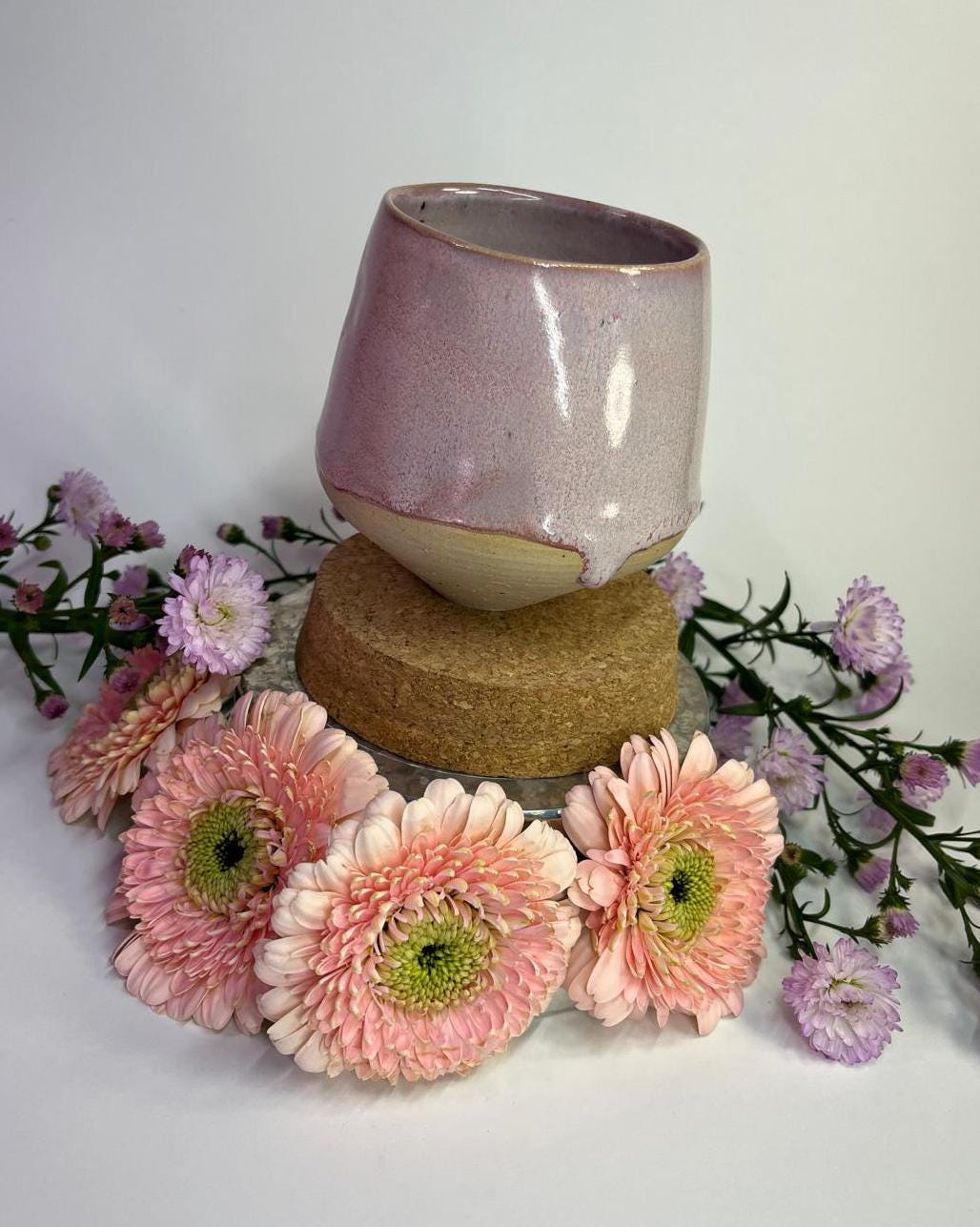 Handmade ceramic mug with pink drippy glaze