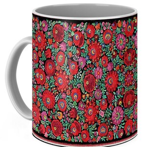 May include: A white ceramic mug with a black rim and handle. The mug features a colorful floral pattern with red, pink, green, and yellow flowers on a black background.