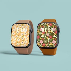 May include: Two Apple Watch smartwatches with different floral watch faces. The watch on the left has a yellow and white floral pattern. The watch on the right has a green, pink, and white floral pattern. Both watches have a digital clock face displaying the time as 10:09.