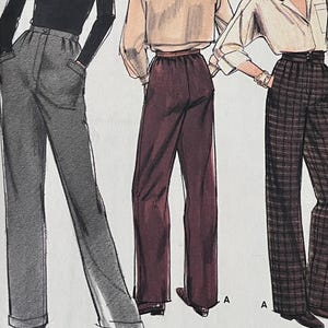 Puede incluir: Patrón de costura Vogue Patterns 9447 con ilustraciones de tres conjuntos diferentes para mujer, que incluyen pantalones y tops. El patrón incluye un cuello alto, un top corto y una camisa abotonada. El tamaño del patrón es (14-16-18).