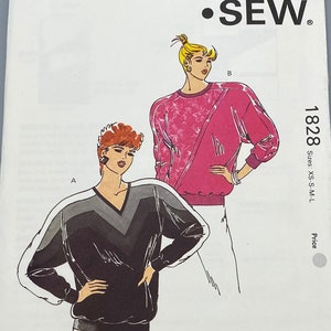 May include: A sewing pattern for a sweater with two different styles. The pattern is from Kwik Sew Pattern Co., Inc. and is number 1828. The pattern is for sizes XS-S-M-L.